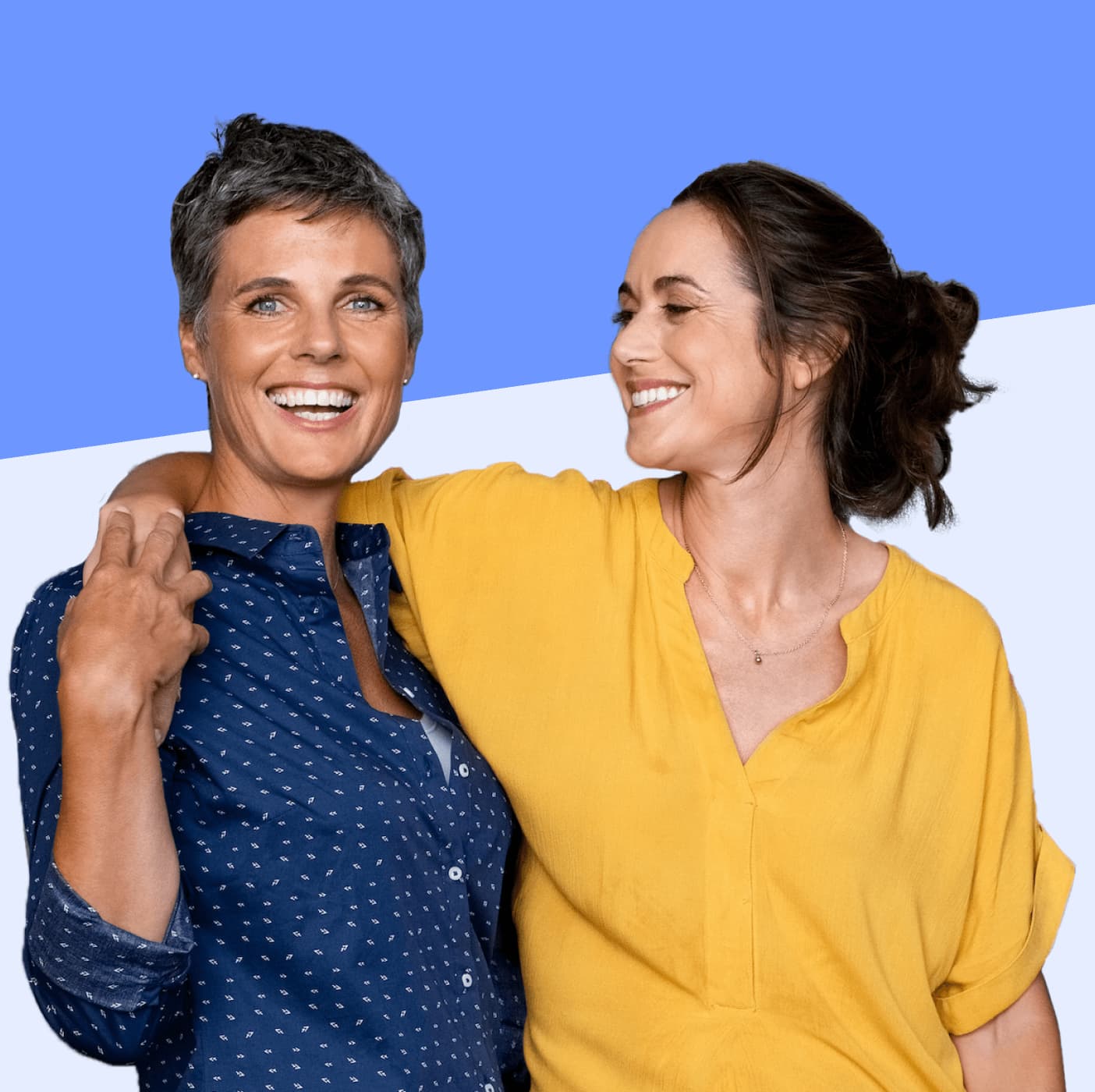 Two middle-aged women with arms around each other smiling.